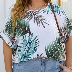 PLUS SIZE TROPICAL TOP WITH ROUNDED NECKLINE. DOLMAN STYLE SHORT SLEEVES.